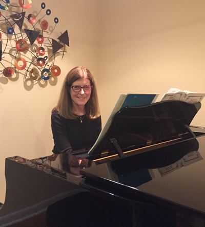 Susan Ensor at her piano at home